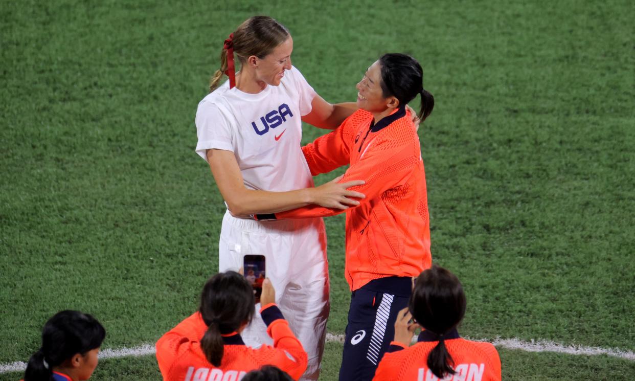 Japan's Yukiko Ueno (R) hugs USA's Monica Abbott (L) after the medal ceremony for the softball competition in the Tokyo 2020 Olympic Games at the Yokohama Baseball Stadium in Yokohama, Japan, on July 27, 2021. (Photo by KAZUHIRO FUJIHARA / AFP) (Photo by KAZUHIRO FUJIHARA/AFP via Getty Images)