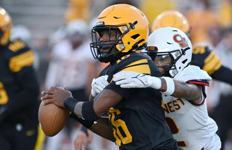 Clovis West’s Jordan Pierro, background, closes in on Edison quarterback Phoenix Lawrence for the sack Friday, Sept. 15, 2023 in Fresno. ERIC PAUL ZAMORA/ezamora@fresnobee.com