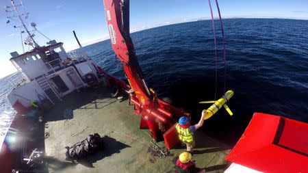 Crew members aboard the VOS Raasay recover U.S. and British Royal Navy ocean gliders taking part in the Unmanned Warrior exercise off the northwest coast of Scotland on October 8, 2016. Courtesy Santiago Carrizosa/U.S. Navy/Handout via REUTERS