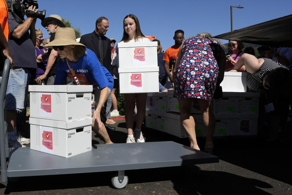 Arizona abortion-rights supporters deliver over 800,000 petition signatures to the capitol to get abortion rights on the November general election ballot Wednesday, July 3, 2024, in Phoenix. (AP Photo/Ross D. Franklin)