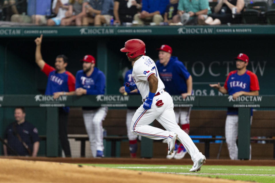 Texas Rangers' Andy Ibáñez runs to first base after hitting a home run during the first inning of a baseball game against the Oakland Athletics, Monday, June 21, 2021, in Arlington, Texas. (AP Photo/Sam Hodde)