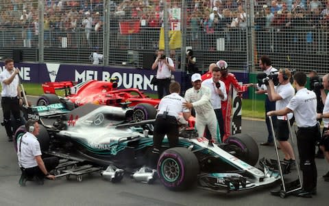 Lewis Hamilton is congratulated after claiming pole - Credit: AFP