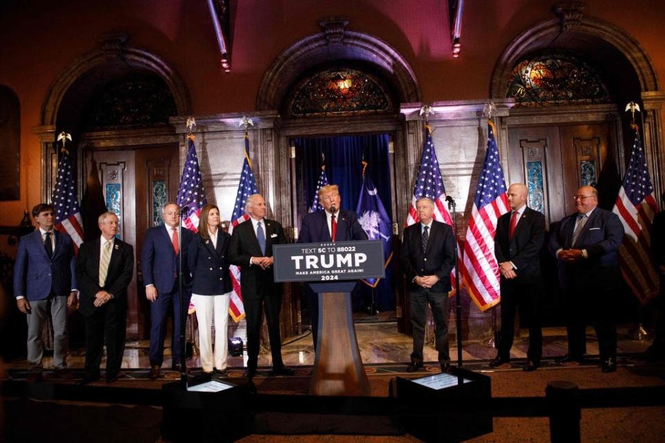 Former US President Donald Trump, joined by members of his leadership team, speaks at a 2024 election campaign event in Columbia, South Carolina, on January 28, 2023.