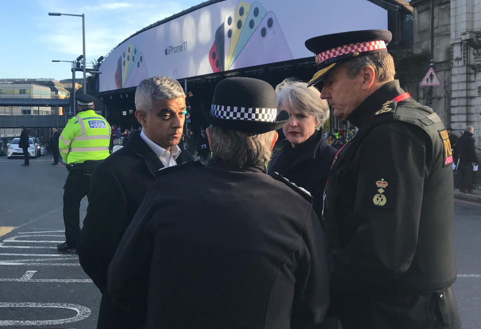 Mayor of London Sadiq Khan speaks with Metropolitan Police Commissioner Cressida Dick and Commissioner of the City of London Police Ian Dyson, as he attends London Bridge in central London after a terrorist wearing a fake suicide vest who went on a knife rampage killing two people, was shot dead by police.