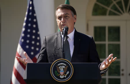 Brazil's President Jair Bolsonaro speaks during a joint news conference with U.S. President Donald Trump in the Rose Garden of the White House in Washington, U.S., March 19, 2019. REUTERS/Kevin Lamarque