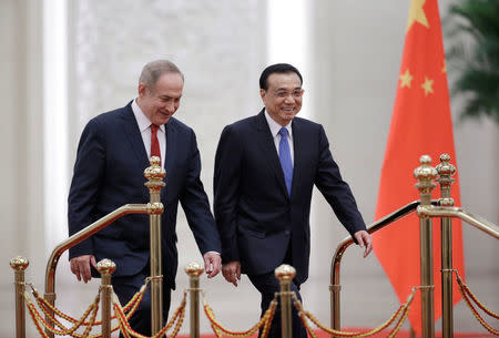 Israeli Prime Minister Benjamin Netanyahu (L) and China's Premier Li Keqiang attend a welcoming ceremony at the Great Hall of the People in Beijing, China March 20, 2017. REUTERS/Jason Lee