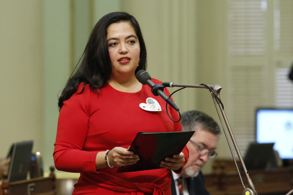 FILE - In this Feb. 10, 2020, file photo Assemblywoman Wendy Carrillo, D-Los Angeles speaks in the Assembly in Sacramento, Calif. California lawmakers approved Carrillo's measure to approve reparations for victims who were forcibly sterilized by the state. The state's new budget, that is awaiting Gov. Gavin Newsom's signature, includes $7.5 million for the program. Carrillo said the goal is to pay victims $25,000 each. (AP Photo/Rich Pedroncelli, File)