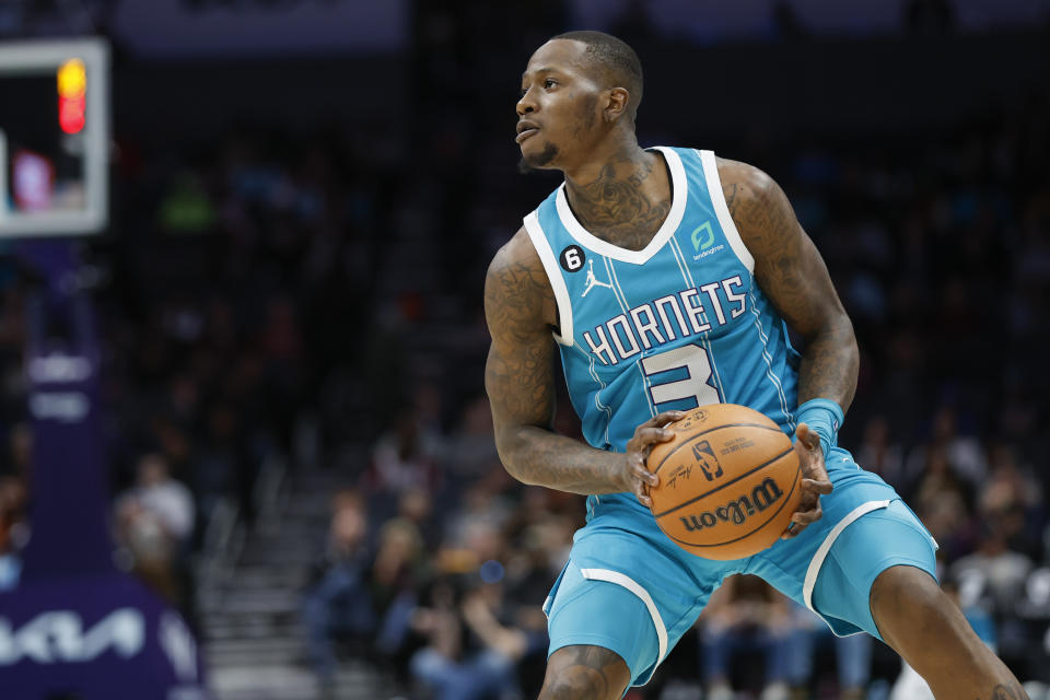 Charlotte Hornets guard Terry Rozier looks to shoot against the Cleveland Cavaliers during the first half of an NBA basketball game in Charlotte, N.C., Sunday, March 12, 2023. (AP Photo/Nell Redmond)