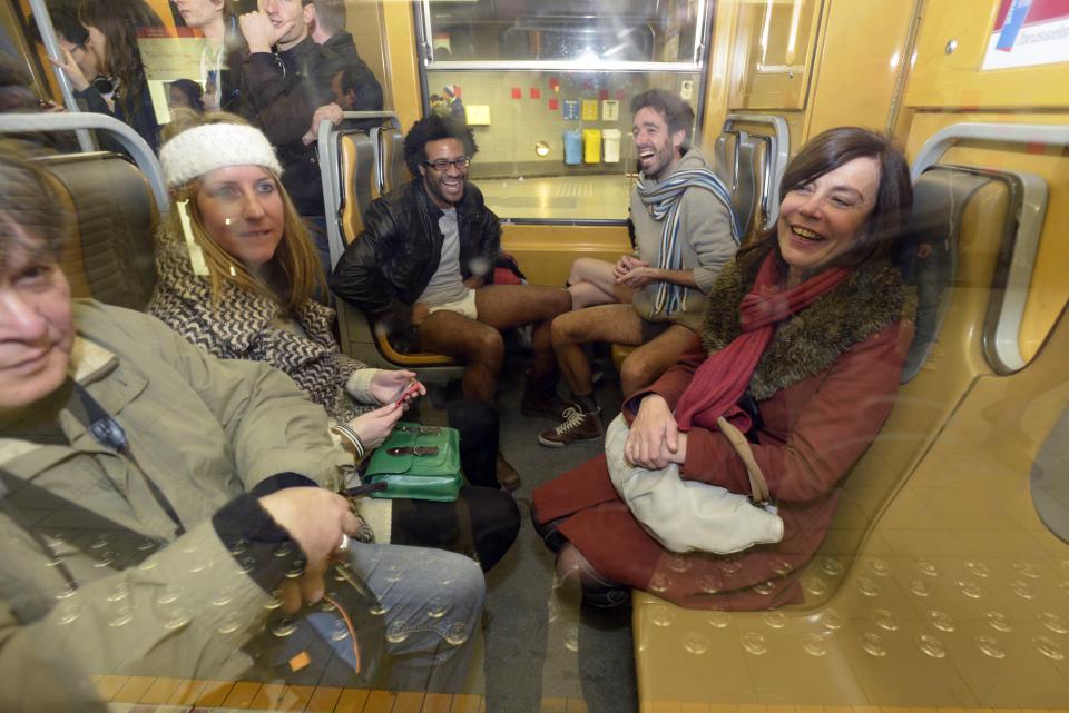 People take part in the annual "No Pants Subway Ride" in the subway in Brussels