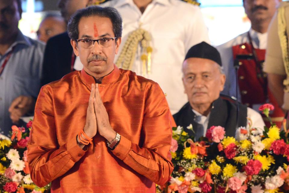 Maharashtra's Governor Bhagat Singh Koshyari (R) looks on as new chief minister Uddhav Thackeray gestures after taking his oath of office during a swearing-in ceremony in Mumbai on November 28, 2019. (Photo by STR / AFP) (Photo by STR/AFP via Getty Images)