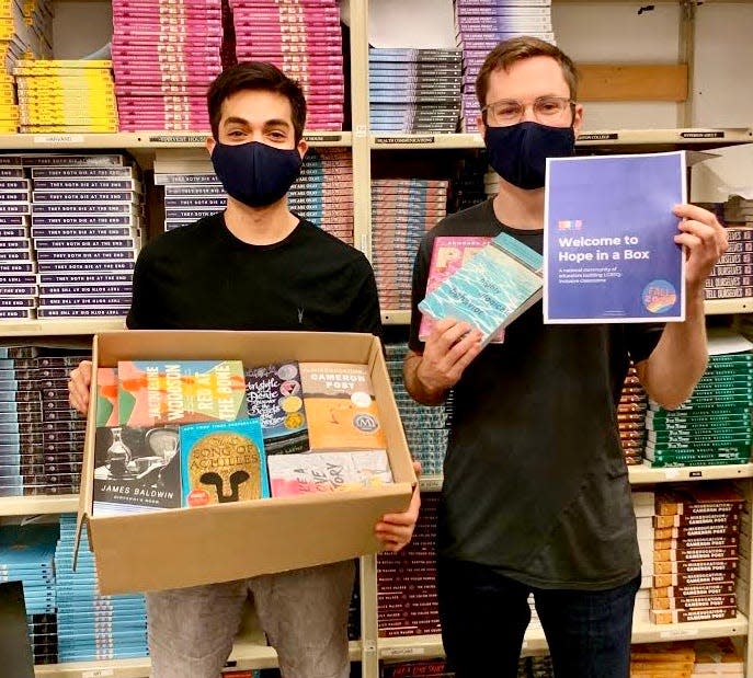 Hope In A Box founder Joe English (left) and Daniel Tartakovsky pack boxes ahead of the 2020 fall semester.