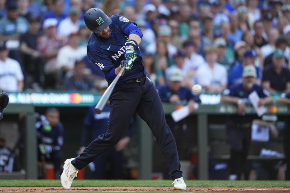 National League's J.D. Martinez, of the Los Angeles Dodgers, hits a single during the second inning of the MLB All-Star baseball game in Seattle, Tuesday, July 11, 2023. (AP Photo/Lindsey Wasson)