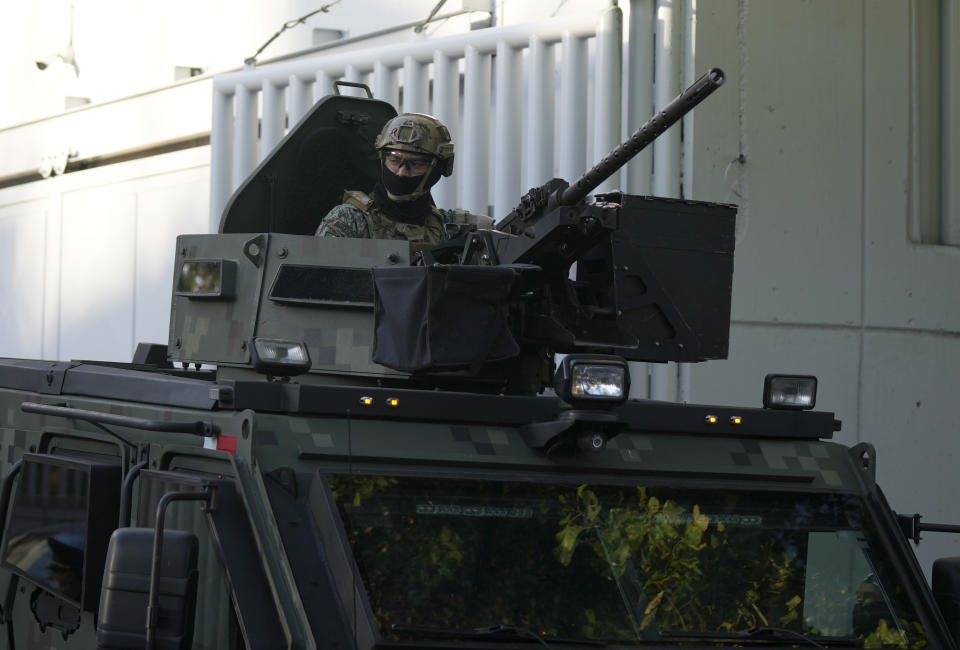 An armored vehicle drives out of the prosecutor's building where Ovidio Guzmán, one of the sons of former Sinaloa cartel boss Joaquin "El Chapo" Guzmán, is in custody in Mexico City, Thursday, Jan. 5, 2023. The Mexican military has captured Ovidio Guzman during a operation outside Culiacan, a stronghold of the Sinaloa drug cartel in western Mexico. (AP Photo/Fernando Llano)