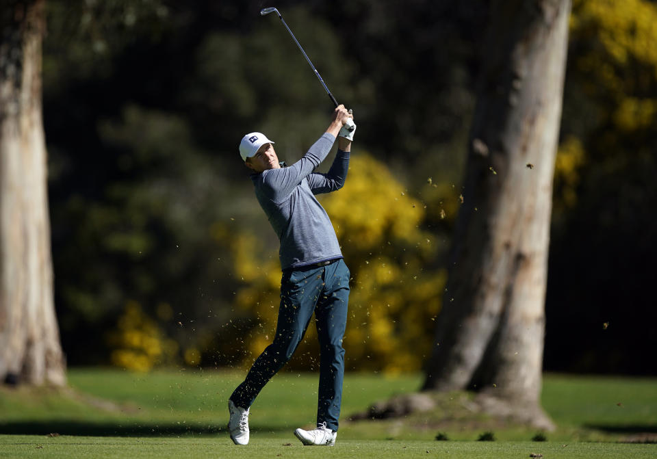 Jordan Spieth hits his second shot on the 13th hole as second round play continues during the Genesis Open golf tournament at Riviera Country Club on Saturday, Feb. 16, 2019, in the Pacific Palisades area of Los Angeles. (AP Photo/Ryan Kang)