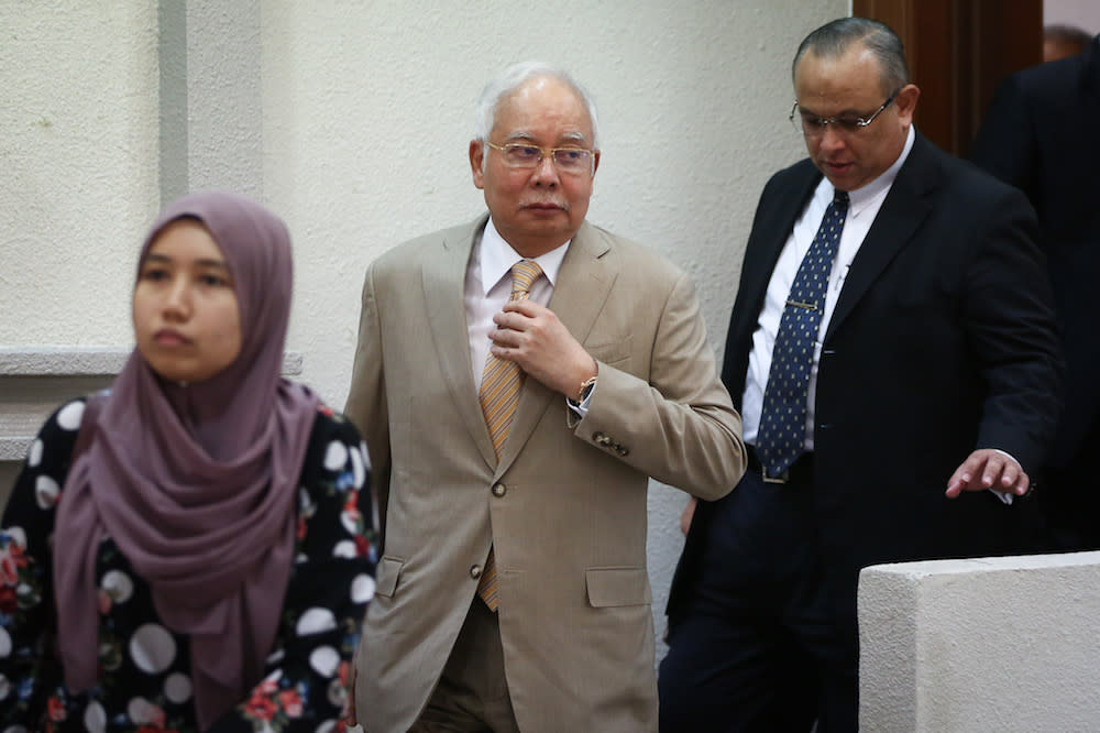 Former prime minister Datuk Seri Najib Razak leaves the courtroom for a short recess during his trial at the Kuala Lumpur High Court December 11, 2019. — Picture by Yusof Mat Isa