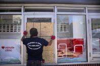 Damaged storefronts are seen during nationwide unrest following the death in Minneapolis police custody of George Floyd in Manhattan