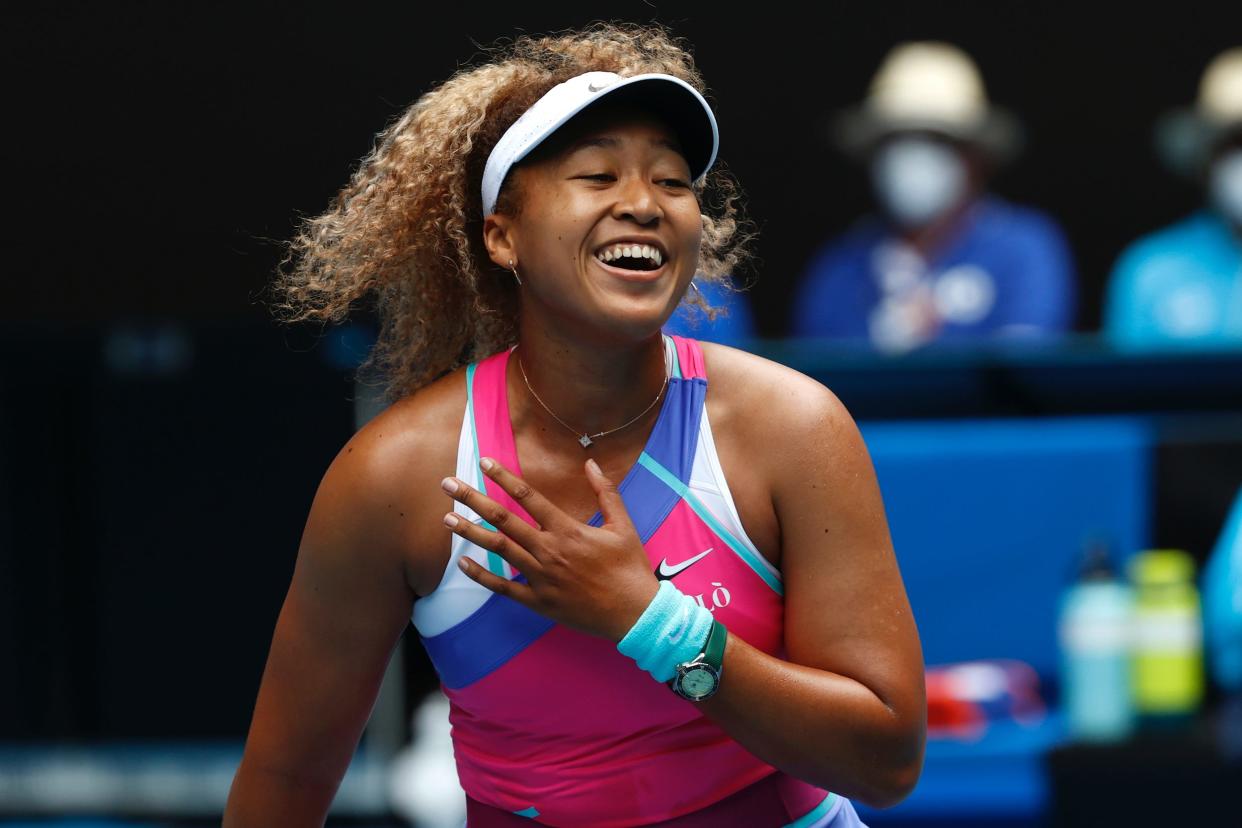 Naomi Osaka laughs.