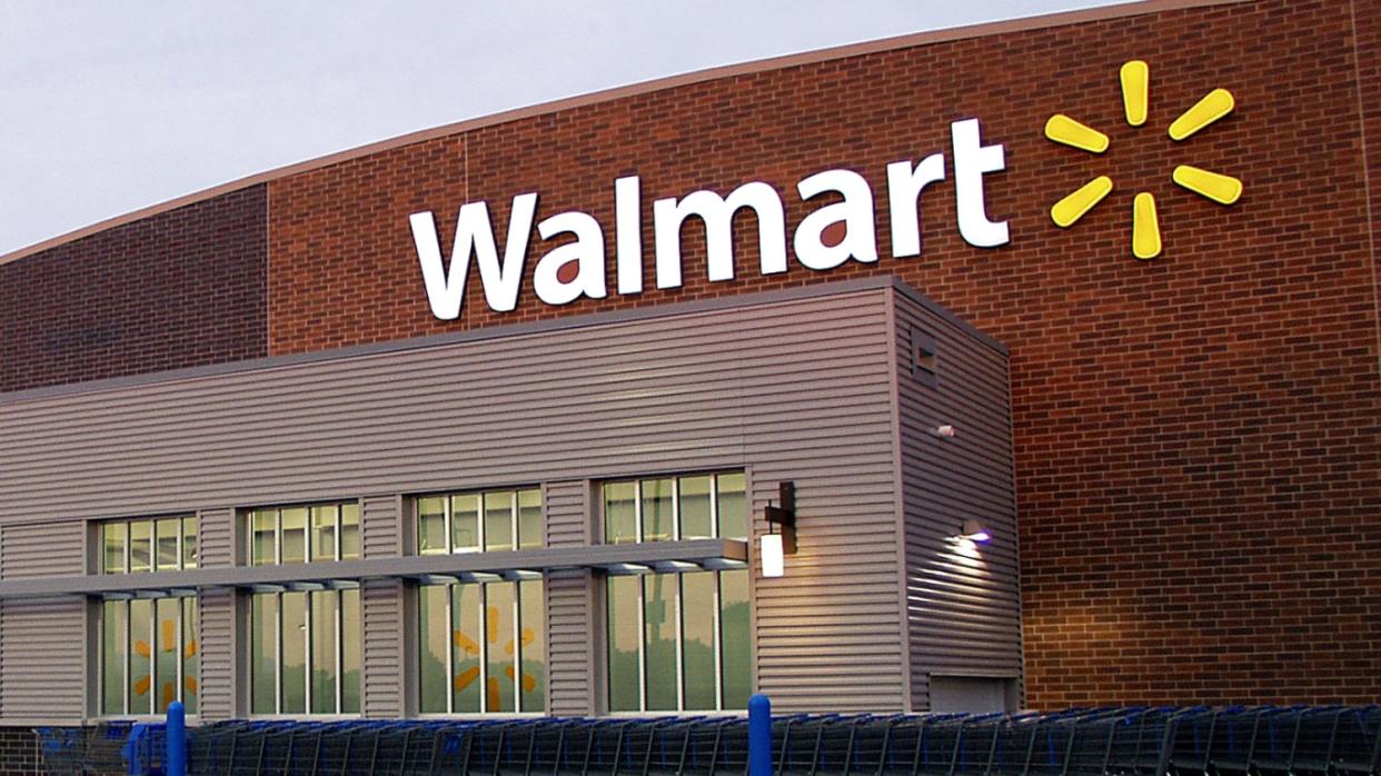  Walmart store sign as seen from the exterior . 