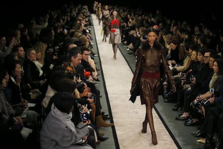 Models present creations by Italian designer Riccardo Tisci as part of his Fall/Winter 2014-2015 women's ready-to-wear collection for fashion house Givenchy during Paris Fashion Week March 2, 2014. REUTERS/Stephane Mahe/File Photo