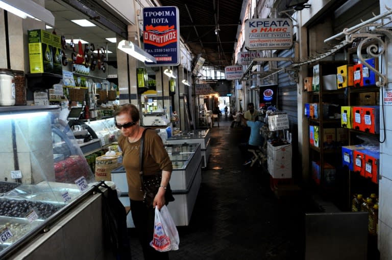 A woman shopping at the main meat market in Thessaloniki, on July 6, 2015