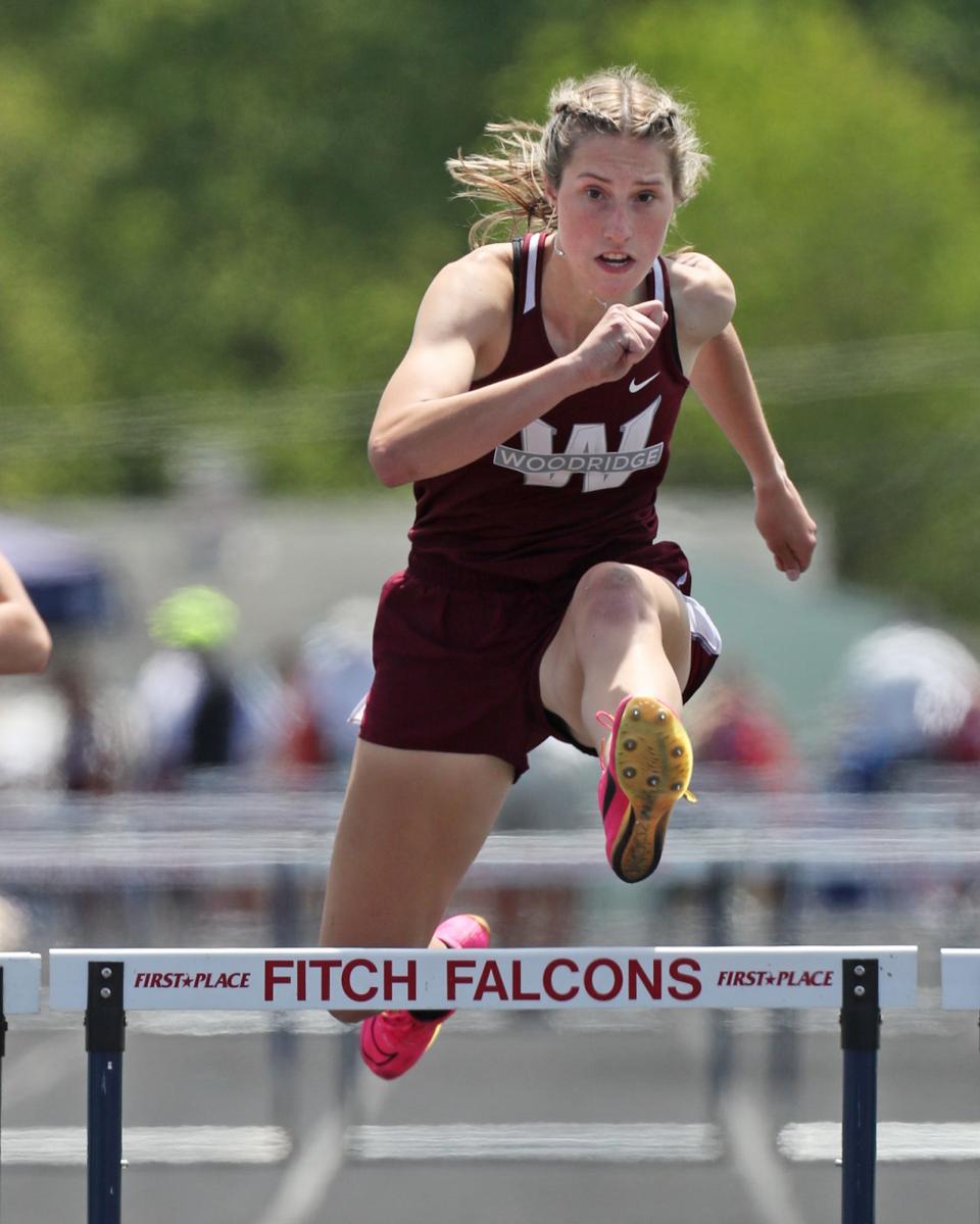 Woddridge's Anna Rorrer clears the last hurdle on her way to a first-place finish in the girls 300 hurdles at the Division II regional track meet Saturday at Austintown Fitch.