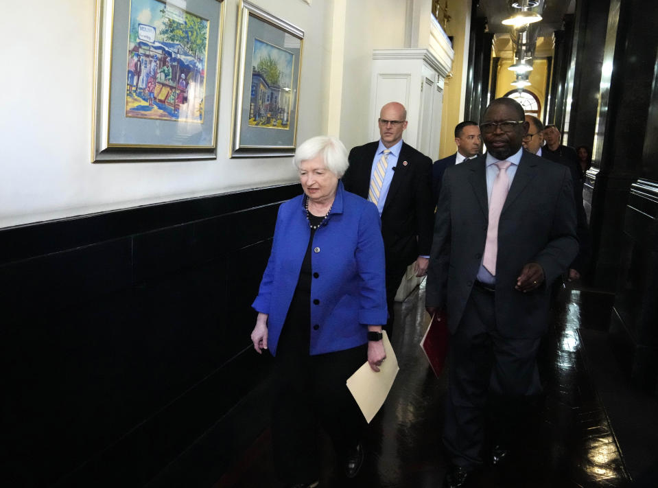 U.S. Treasury Secretary Janet Yellen, walks with South Africa's Minister of Finance Enoch Godongwana ahead of their meeting at the National Treasury in Pretoria, South Africa, Thursday, Jan. 26, 2023. Yellen is on a 10-day tour of Africa, part of a push by the Biden administration to engage more with the world's second-largest continent. (AP Photo/Themba Hadebe)