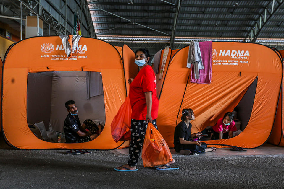 A general view of tents used by flood victims at the temporary evacuation centre (PPS) in Taman Sri Muda in Shah Alam, Selangor December 21, 2021. — Picture by Hari Anggara