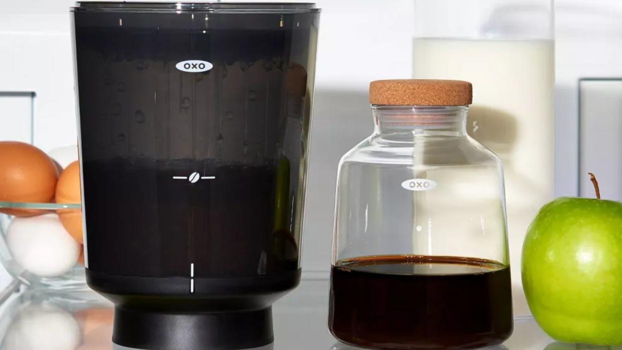  An OXO Brew Compact Cold Brew Coffee Maker on a refrigerator shelf 