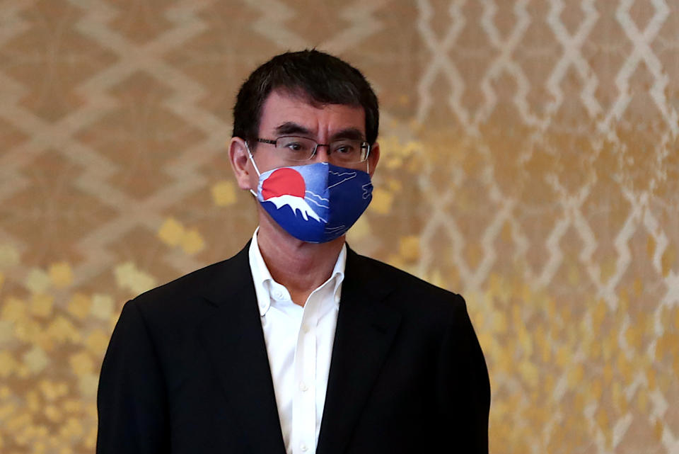 Japan's Defense Minister Taro Kono, wearing a face mask to to help curb the spread of the new coronavirus, waits for U.S. Deputy Secretary of State Stephen Biegun, the top U.S. official on North Korea, to arrive for a bilateral meeting in Tokyo Friday, July 10, 2020. (Behrouz Mehri/Pool Photo via AP)