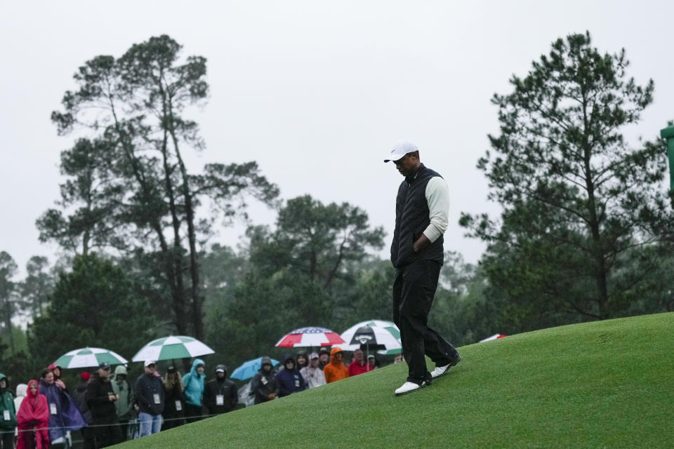 Tiger Woods walks on the 18th hole during the weather delayed second round of the Masters golf tournament at Augusta National Golf Club on Saturday, April 8, 2023, in Augusta, Ga. (AP Photo/Jae C. Hong)