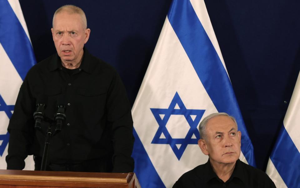 Yoav Gallant and Benjamin Netanyahu address a press conference in The Kirya military base in Tel Aviv, Israel, in October 2023