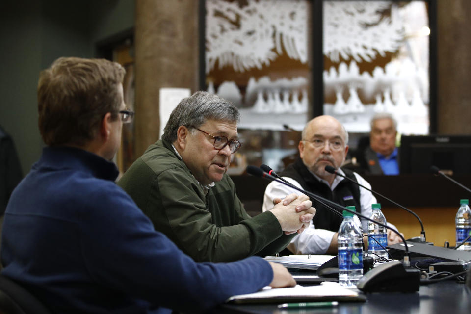 Attorney General William Barr speaks at a Confederated Salish and Kootenai Tribes council meeting, Friday, Nov. 22, 2019, on the Flathead Reservation in Pablo, Mont. Sitting with Barr are Tracy Toulou, right, director of the Justice Department's Office of Tribal Justice, and Kurt Alme, U.S. Attorney for the District of Montana. (AP Photo/Patrick Semansky)