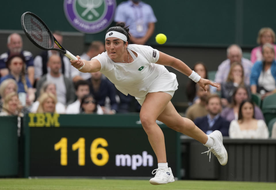 Tunisia's Ons Jabeur plays a return to Aryna Sabalenka of Belarus during the women's singles quarterfinals match on day eight of the Wimbledon Tennis Championships in London, Tuesday, July 6, 2021. (AP Photo/Kirsty Wigglesworth)