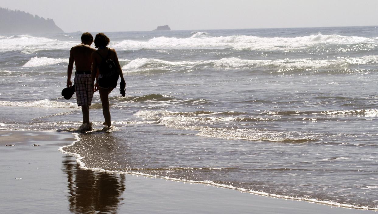 Couple walking along beach