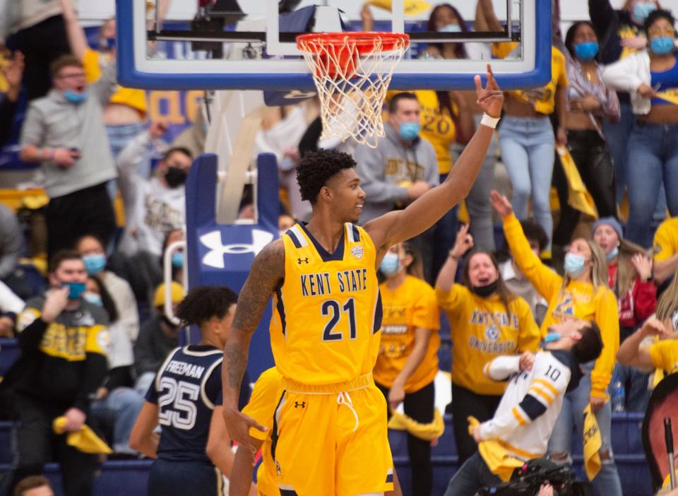 Kent State senior forward Justyn Hamilton reacts after a teammate drained a 3-pointer during Friday night's victory over Akron at the M.A.C. Center.