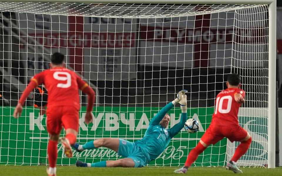 England's goalkeeper Jordan Pickford saves a penalty from North Macedonia's Enis Bardhi only for him to score the rebound