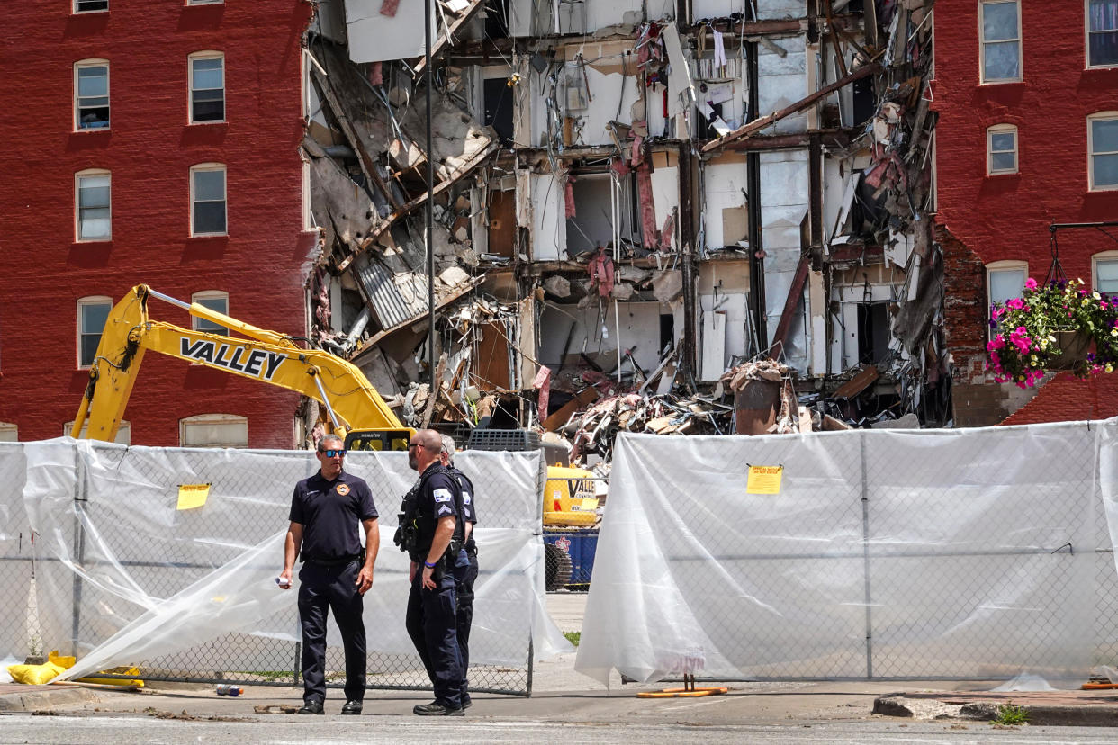 Police continue to secure a six-story apartment building on May 29, 2023, in Davenport, Iowa, after it collapsed the day before. (Scott Olson / Getty Images)