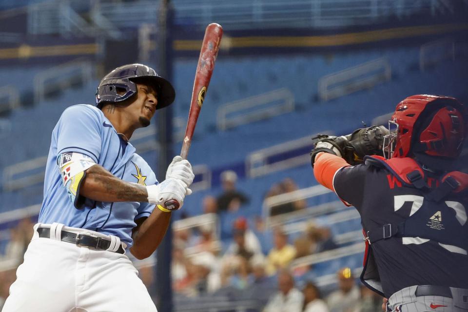 Tampa Bay Rays' Wander Franco (5) reacts to an inside pitch in the first inning of a spring training baseball game against Minnesota Twins at Tropicana Field in St. Petersburg, Fla., Thursday, March 2, 2023. (Ivy Ceballo/Tampa Bay Times via AP)