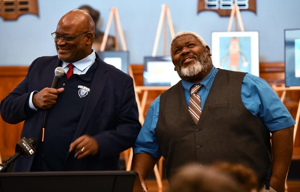 John, right, and Robert Vaughn, sons of Ogretta V. McNeil, talk about their late mother during the ceremony.