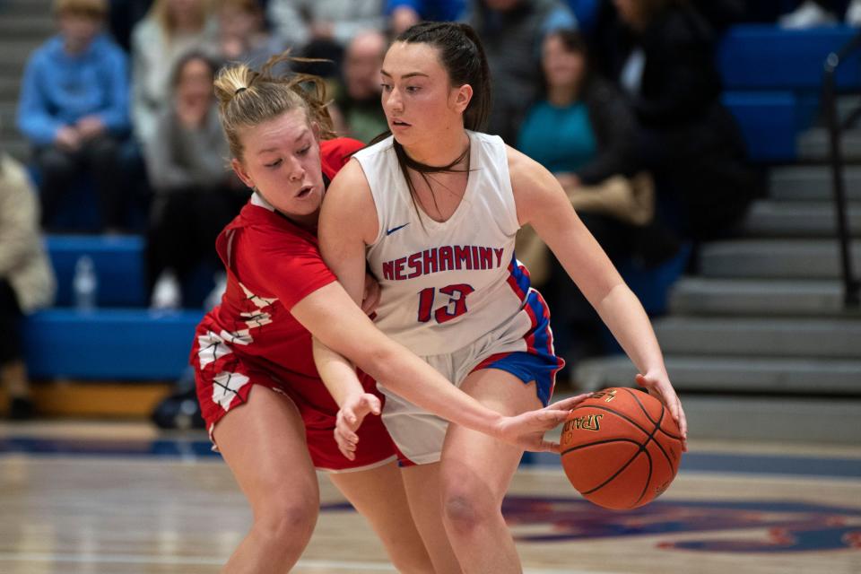 Souderton sophomore Grace McDonough pushes to steal the ball from Neshaminy senior Taylor Gurysh at Neshaminy High School on Friday, Jan. 13, 2023. Neshaminy girls basketball defeated Souderton 37-32.