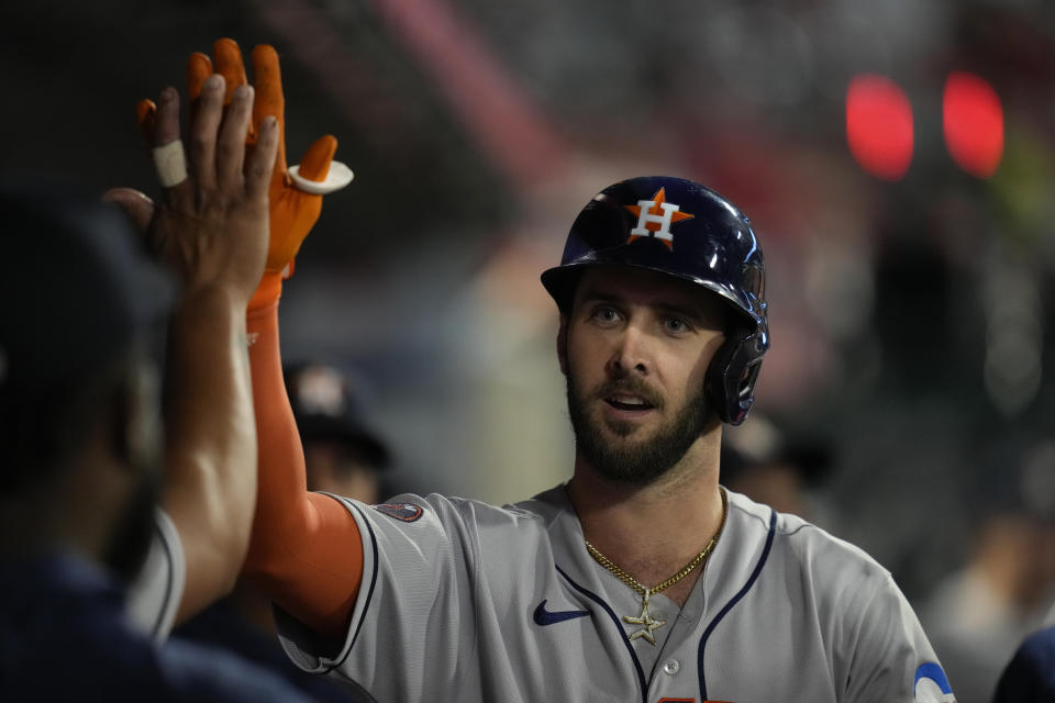 Houston Astros' David Hensley (17) celebrates in the dugout after hitting a home run during the fifth inning of a baseball game against the Los Angeles Angels in Anaheim, Calif., Monday, May 8, 2023. (AP Photo/Ashley Landis)