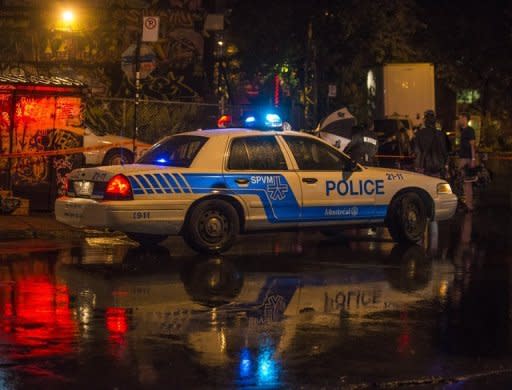 Police secure the Metropolis theatre after a gunman opened fire during the victory speech of Quebec's newly elected separatist premier, Pauline Marois of the Parti Quebecois, on September 4, in Montreal. One person was killed in the shooting during the speech by Marois, whose separatist party is projected to win polls in the French-speaking province