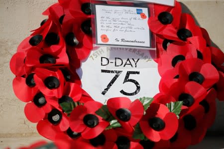 A wreath of flowers is seen before the Royal British Legion’s commemoration ceremony for the 75th anniversary of D-Day, at the Commonwealth War Cemetery in Bayeux