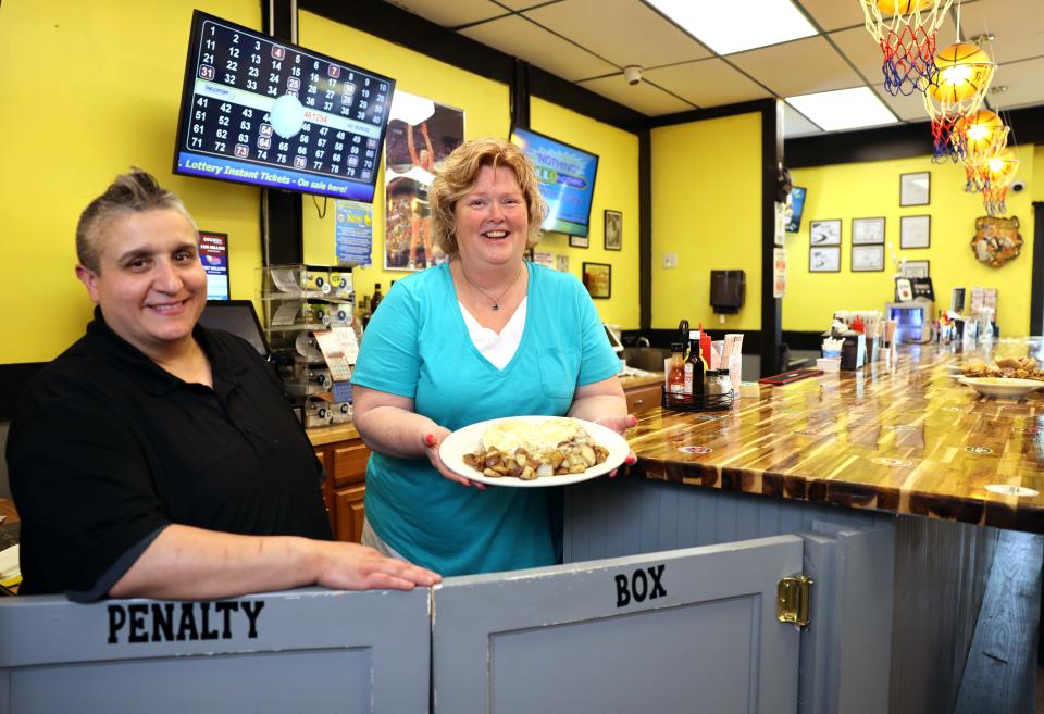 2 Gals Sports Bar and Grill owners from left, Graceand Carol Rodrigues, 201 North Quincy St., Abington, on Friday, May 27, 2022.