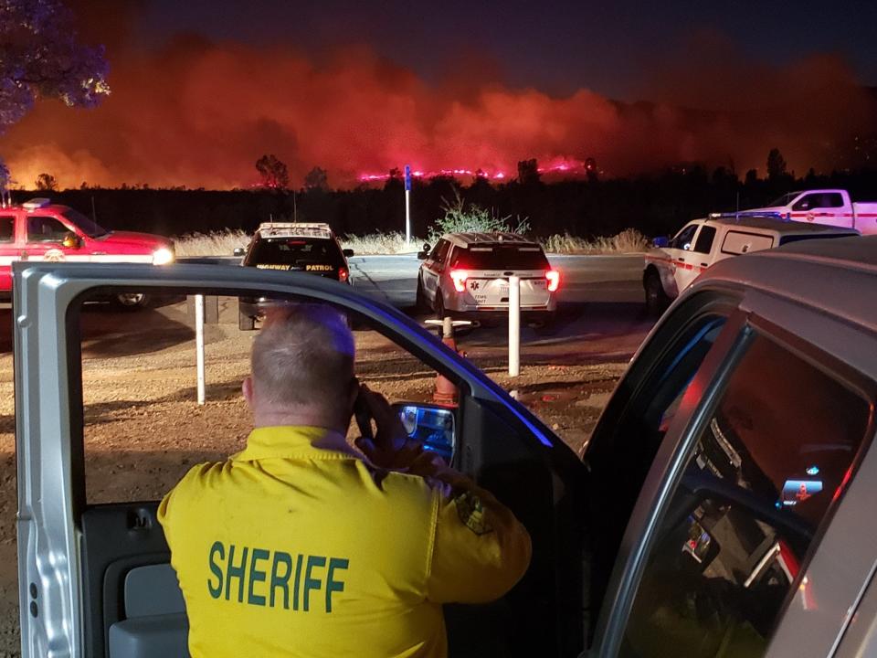 Authorities stand by as fire crews battle the Zogg Fire on Sunday, Sept. 27, 2020. The fire broke out just before 3 p.m. in Igo and within hours, driven by strong north winds, grew to 7,000 acres.