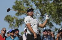 Kurt Kitamaya from the U.S. follows his ball on the 2nd hole during the final round of the Abu Dhabi Championship golf tournament in Abu Dhabi, United Arab Emirates, Sunday, Jan. 19, 2020. (AP Photo/Kamran Jebreili)