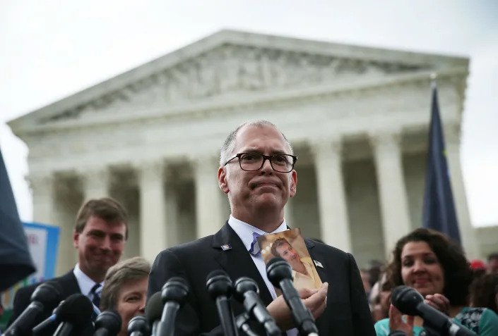 Plaintiff Jim Obergefell holds a photo of his late husband John Arthur as he speaks to members of the media after the U.S. Supreme Court handed down a ruling regarding same-sex marriage June 26, 2015, outside the Supreme Court in Washington, D.C. The high court ruled that same-sex couples have the right to marry in all 50 states.