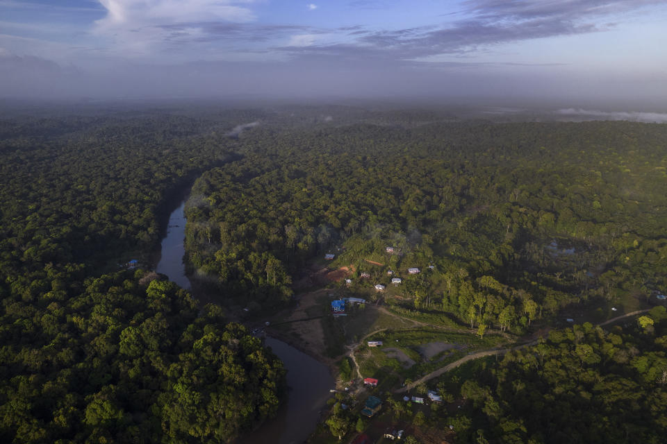 An aerial view of Chinese Landing Amerindian territory, Guyana, Monday, April 17, 2023. Called Chinese Landing for reasons residents no longer remember, the village is deep within lush forests of northern Guyana accessible primarily by riverboat. (AP Photo/Matias Delacroix)