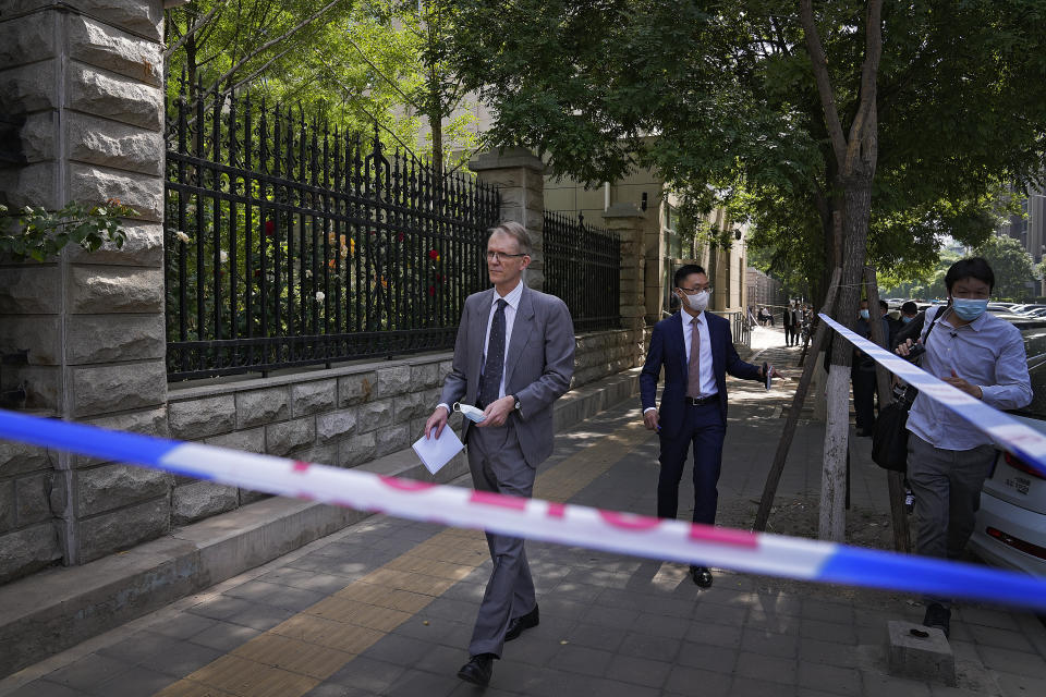 Australian ambassador to China Graham Fletcher, left, leaves the No. 2 Intermediate People's Court after he was denied to attend the espionage charges case for Yang Hengjun, in Beijing, Thursday, May 27, 2021. Fletcher said it was “regrettable” that the embassy was denied access Thursday as a trial was due to start for Yang, a Chinese Australian man charged with espionage. (AP Photo/Andy Wong)