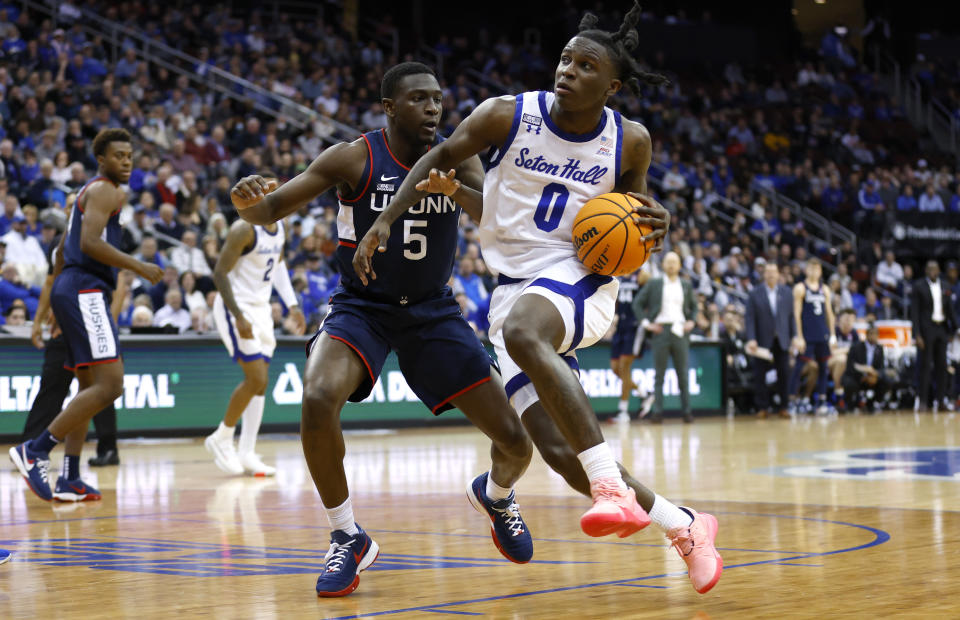 Seton Hall guard Kadary Richmond (0) drives to the basket against UConn guard Hassan Diarra (5) during the second half of an NCAA college basketball game in Newark, N.J., Wednesday, Jan. 18, 2023. Seton Hall won 67-66. (AP Photo/Noah K. Murray)